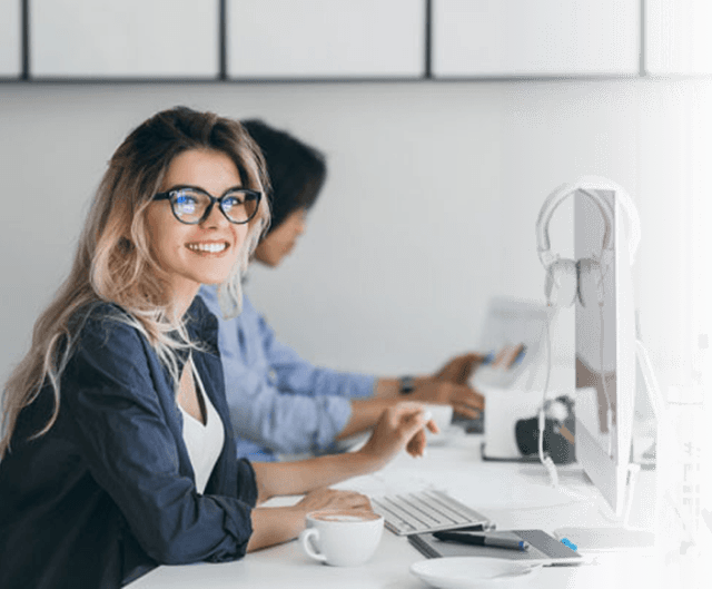 smiling girl at  a computer
