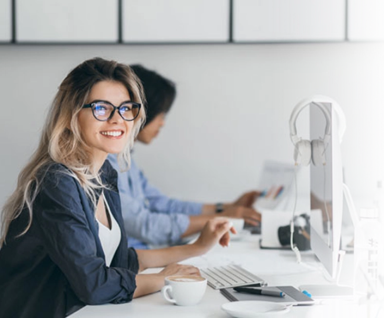 smiling girl at  a computer